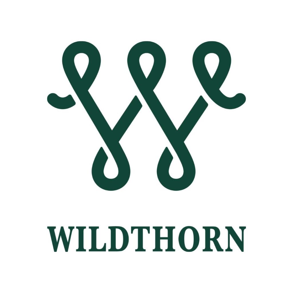 A dark green W with loops at the points sits above the word Wildthorn in all capitals.