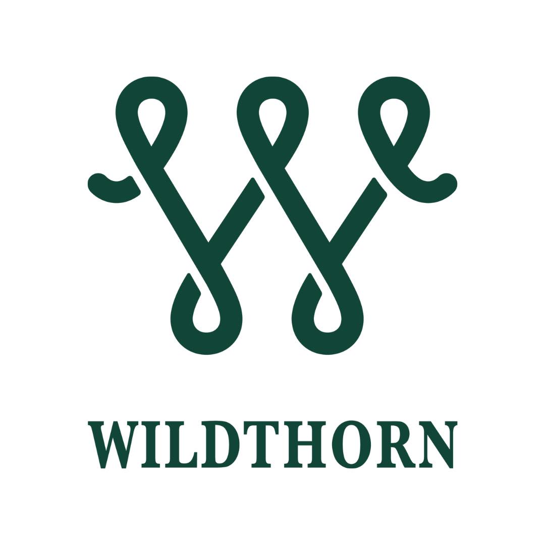A dark green W with loops at the points sits above the word Wildthorn in all capitals.